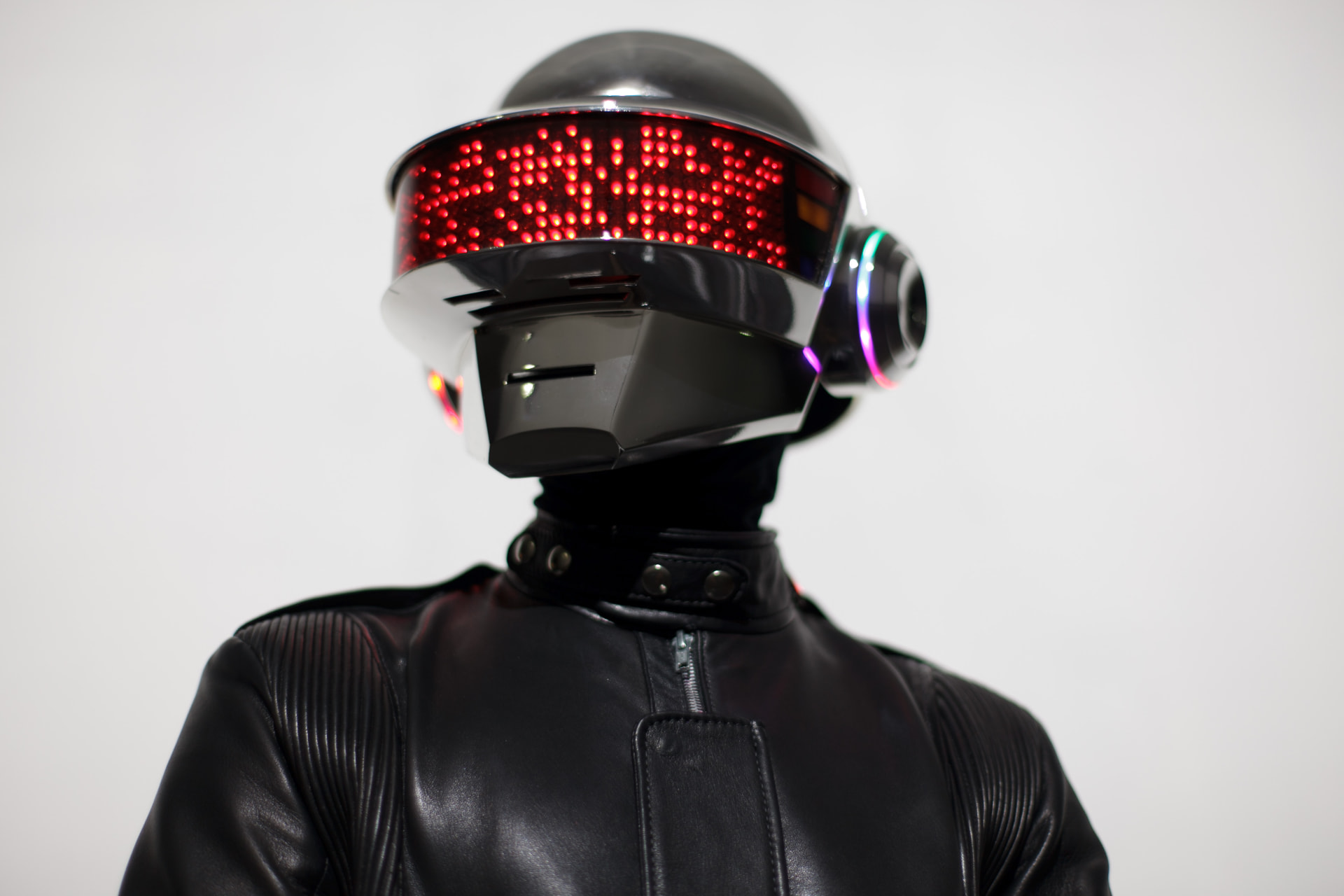 Close portrait of an LED-visor helmet on white