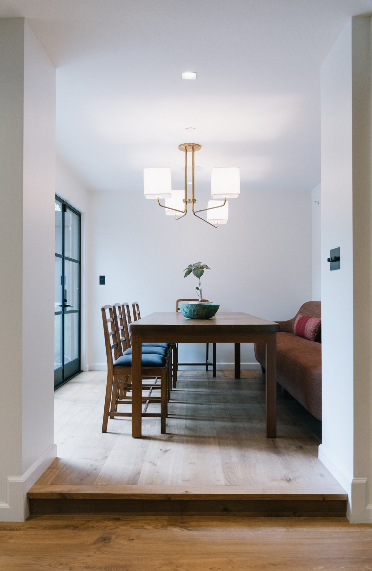 Dining room with brass chandelier