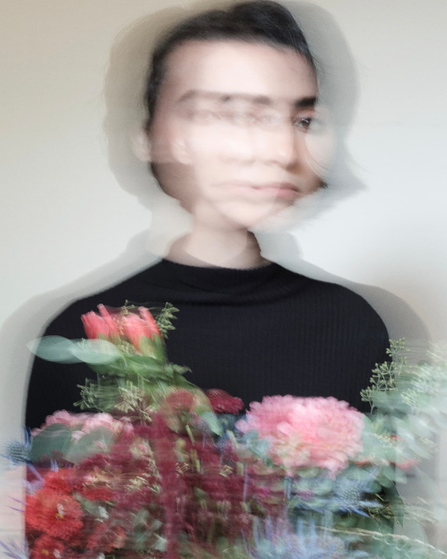 Motion-blurred portrait holding a bouquet of flowers by Dan Almasy