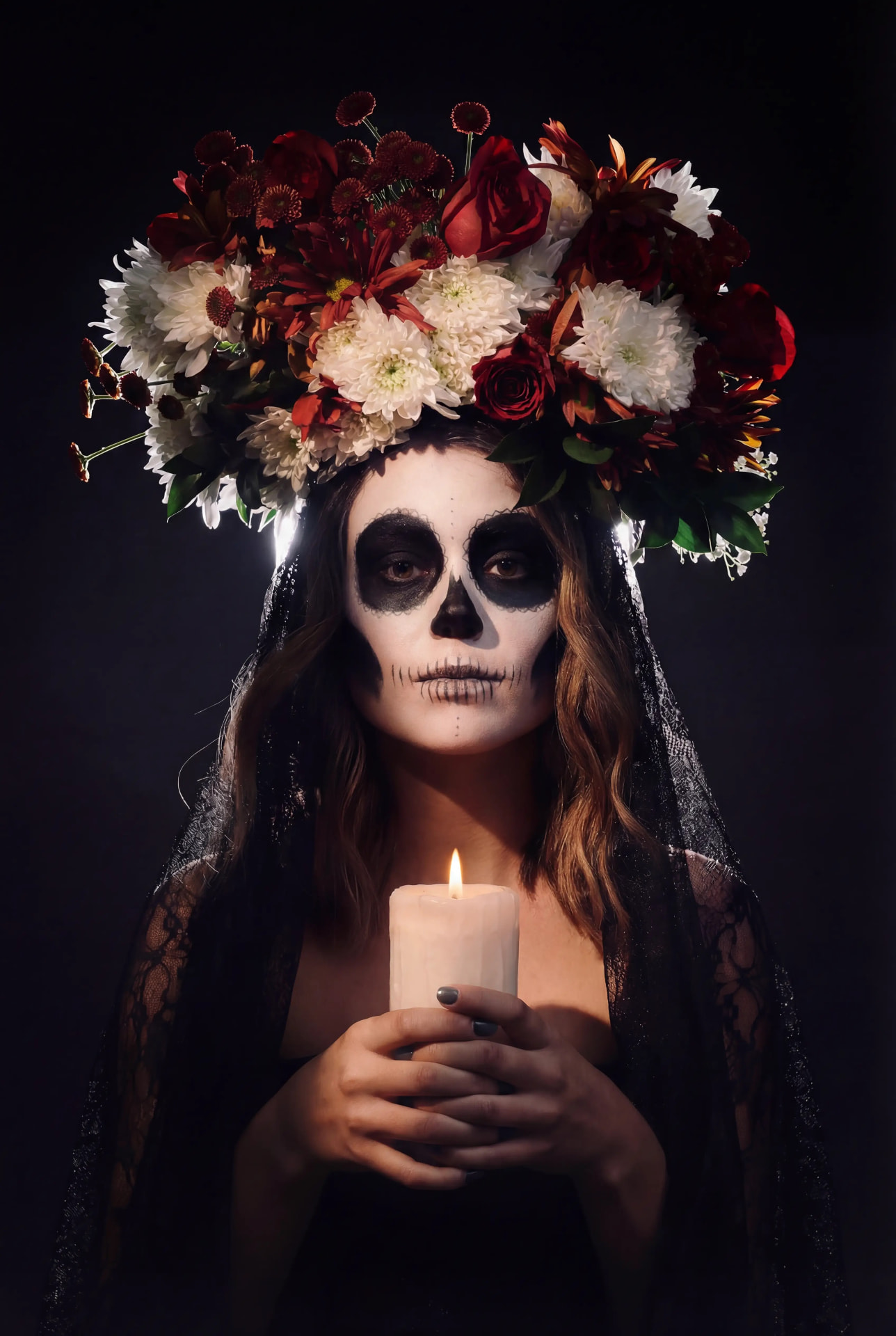 Dia de los Muertos portrait with flower crown and candle by Dan Almasy