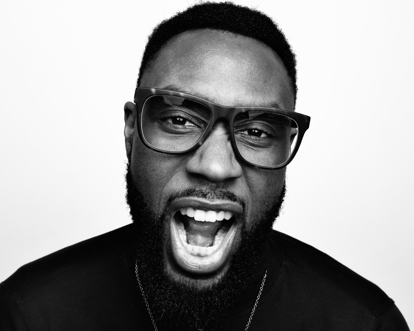 Black and white studio portrait, mouth wide open, by Dan Almasy