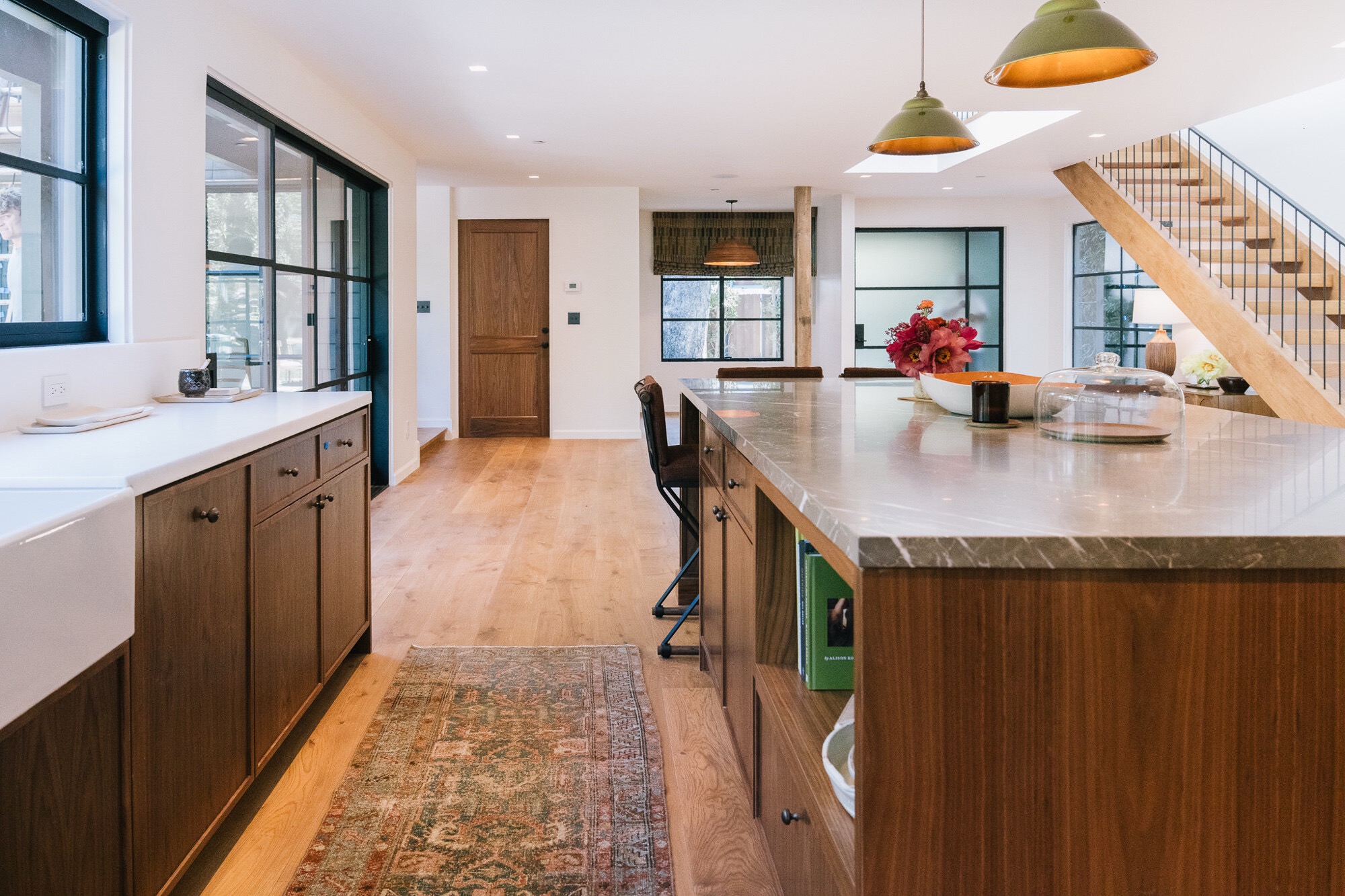 Open-plan kitchen with marble islands
